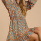 Collared neckline button down floral print dress with crochet trimmed details